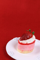Close up Strawberry Cheese cake on red Background