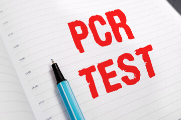 Word writing text Pcr Test. Business photo showcasing qualitative detection of viral genome within the short seqeunce of DNA Paper accesories with digital smartphone arranged on different background