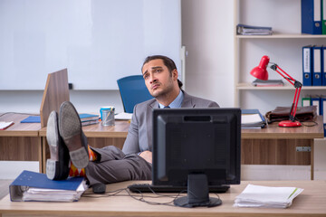 Young male businessman employee working in the office