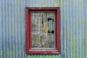 Typical old patagonian window with broken glass,Jaramillo, Argentina