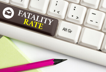 Conceptual hand writing showing Fatality Rate. Concept meaning calculated number of deaths over a...