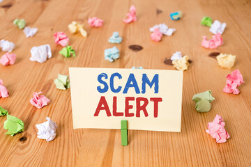 Conceptual hand writing showing Scam Alert. Concept meaning unsolicited email that claims the...
