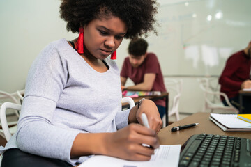 Afro american business woman working in the office.