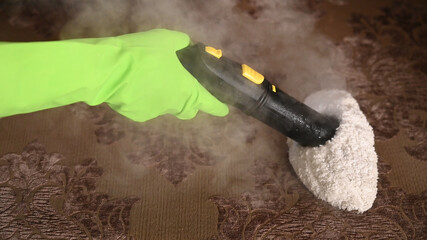 disinfection of upholstered sofa furniture with a steam cleaner.