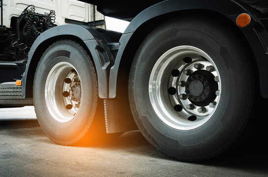Large a truck wheels tires of semi truck. Cargo road freight. Logistics and transportation.