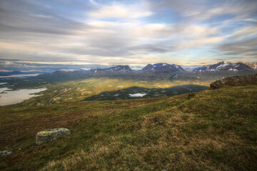 In summer nights here on Mount Nuolja, the mountain casts a shadow on Abisko valley
