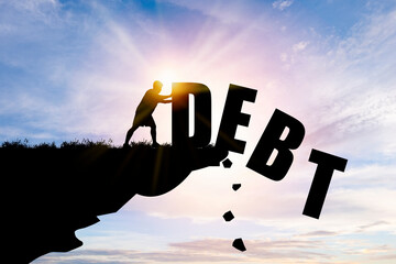 Eliminate or get rid of debt concept , Silhouette man pushed off debt wording a cliff with blue...