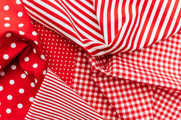 Obraz premium Background from a natural fabric in a red and white colors. Lay flat
