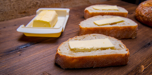 Sandwich ,bread and butter,Maslenitsa with butter on a wooden table with space for text, close-up,