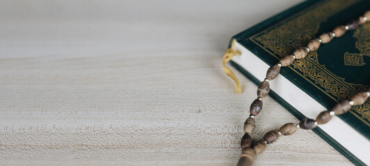 Holy Quran and rosary with banner background copy space. ,Ramadan concept.