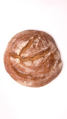 Round grey bread on a white background top view