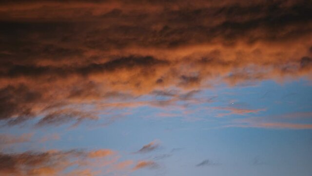 Colorful orange clouds at sundown