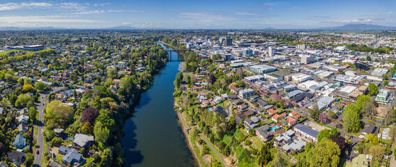 Aerial drone panoramic view over the Waikato River as it cuts through the city of Hamilton, in the Waikato region of New Zealand - obrazy, fototapety, plakaty