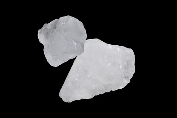 White alum cubes on black background, concept for applying underarms to reduce body odor and swing the cloudy water into the sediment.