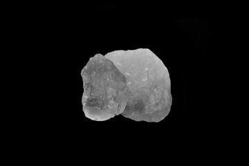 White alum cubes on black background, concept for applying underarms to reduce body odor and swing the cloudy water into the sediment.