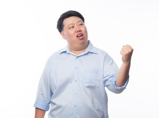 Fototapeta premium Young Fat Asian business man raising his fists with funny face isolated on white background.