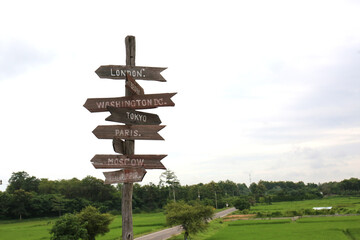 Arrow road sign pointing to the country directions