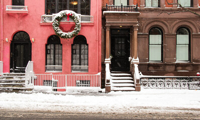 typical new york city street in snowy storm with christmas vibes