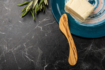 hand crafted wooden knife with butter