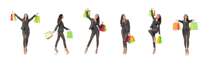 Attractive woman with shopping bags isolated on white