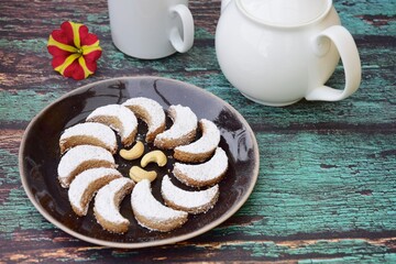 kue Putri salju (snow princess cookies or snow white cookies) is cute crescent shaped vanilla...