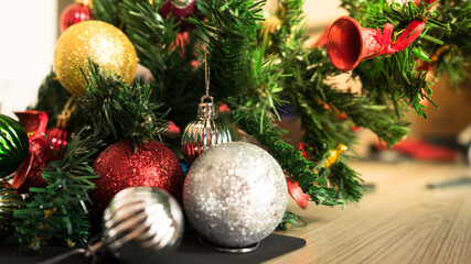 Horizontal image close up and selective focus red wrinkle Christmas ball hanging on Christmas tree for celebrate