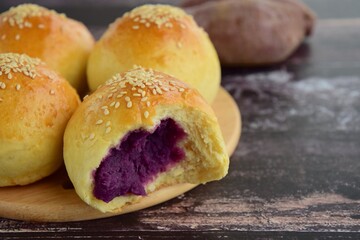 Sesame seed bread buns filled with purple sweet potato / yam puree