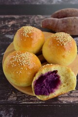 Sesame seed bread buns filled with purple sweet potato / yam puree