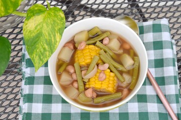 Sayur asem or sayur asam is a popular Indonesian vegetable in tamarind soup. Common ingredients are peanuts, young jackfruit, corn, melinjo,  chayote and long bean.
