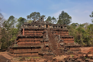 Angkor. Cambodia. Ruins of the Phimeanakas temple. Red building in the form of a stepped pyramid,...