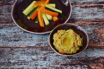 Avocado hummus with zucchini bell pepper veggie sticks
