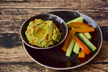 Avocado hummus with zucchini bell pepper veggie sticks
