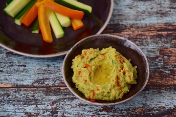 Avocado hummus with zucchini bell pepper veggie sticks