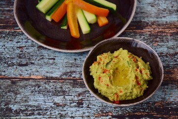 Avocado hummus with zucchini bell pepper veggie sticks