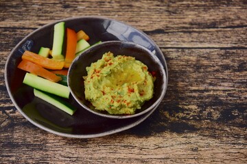 Avocado hummus with zucchini bell pepper veggie sticks
