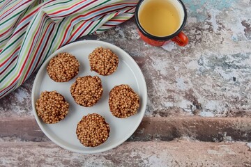 Quinoa puff almond butter chocolate sweet dessert served with hot tea