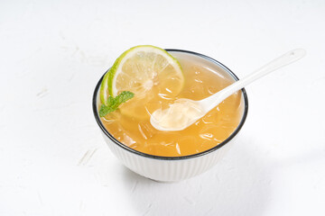 Delicious Taiwanese food - cold drinking dessert Aiyu ice jelly with lemon.