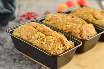 Apricot walnut goji berry oat loaf cake. Selective focus