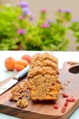 Apricot walnut goji berry oat loaf cake. Selective focus