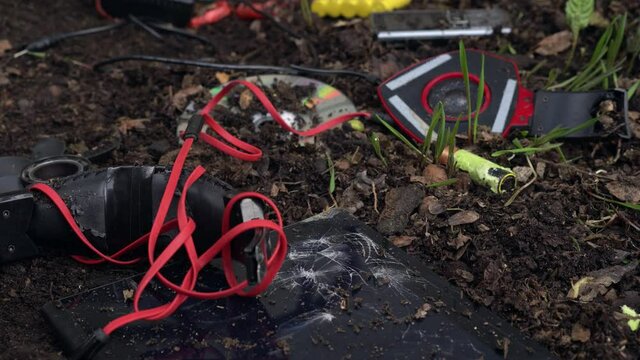 Toxic electronic waste in landfill. E-waste: computers, peripherals, mice, keyboards, and cell phones, batteries, Led lamps, scrap components