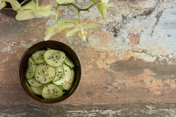 Asian cucumber salad with black sesame seeds and chili flakes