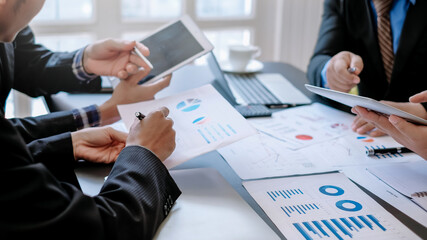 Group of business people discussing finance and investment during the meeting.