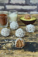 Fototapeta na wymiar Avocado coconut chocolate protein energy balls