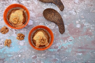 Banana chocolate peanut butter ice cream with walnut. Top view