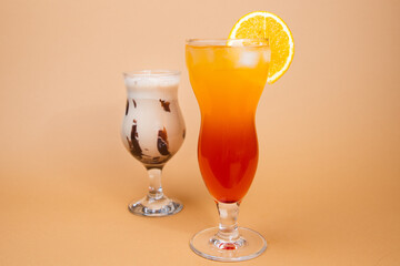 two cocktails on the beige background 