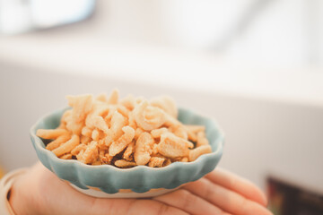 Crispy pork crackling in ceramic cup. Thai food