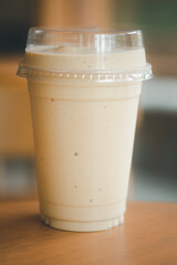 Close up milk coffee smoothie in plastic cup