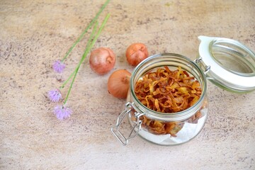Indonesian crispy deep fried shallots or onion flakes (bawang goreng) in a jar
