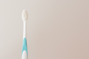 White plastic toothbrush. Soft bristles for healthy gums and tooth enamel. Copy space for your design