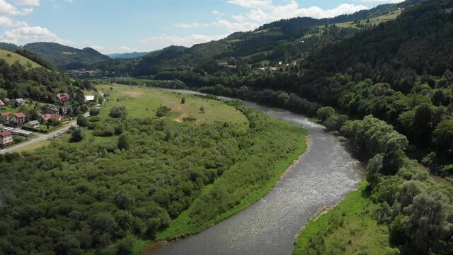 Poprad River in sunny day in summer near village Sucha Struga. Beskid Sadecki Mountains, Poland.